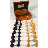 An 20thC chess set, comprising white and black pieces, each king approx 11cm high, contained in a