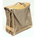 A Louis Vuitton suit holder travel case, in brown with initialled decoration in yellow colours, with