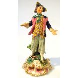 A late 18thC Derby porcelain figure, of a gentleman standing holding sickle, in tricorn hat,