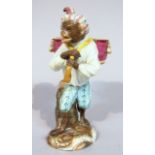 An early 19thC Meissen porcelain monkey band figure, in standing pose, wearing three quarter