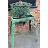 An early 20thC Bamfords mangle cutter, on a metal framed stand in green, no. 4165, 122cm high,