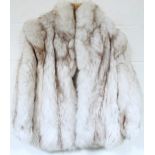 A ladies silver fox fur coat, three quarter length with velvet lined interior, size unknown.