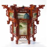 A 20thC soft wood oriental hanging shade, with frosted panels decorated with mountains and trees