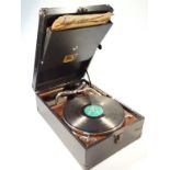 A mid-20thC HMV tabletop gramophone, in a pressed black leather part textured case, hinging to