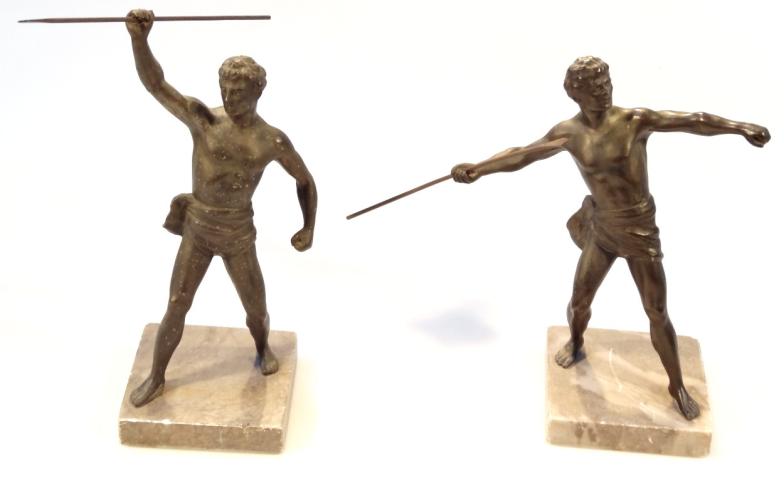 A pair of 20thC spelter and marble finish figures, of classical athletes wearing loincloths and