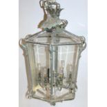 A 19thC cast bronze and glass lantern, of large proportion, the hexagonal body surmounted by a