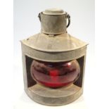 A late 19thC metal cased ship's lantern, of triangular outline with cylindrical top and swing