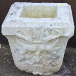 A 20thC moulded stone hopper, with carved decoration.