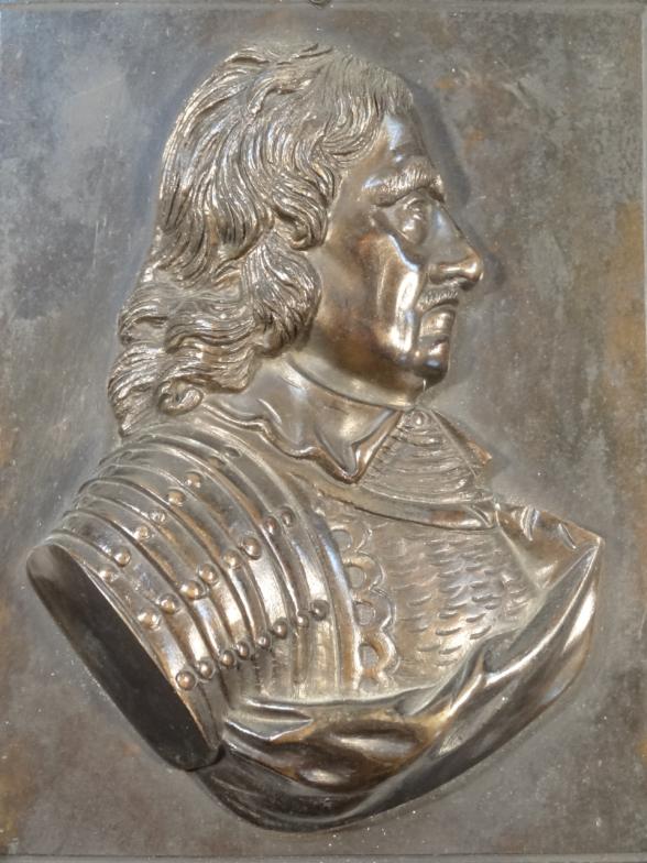 A 20thC relief metal plaque, probably Oliver Cromwell, quarter profile, on a plain rectangular - Image 2 of 2