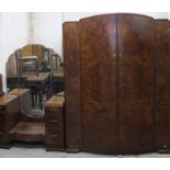 A mid 20thC walnut veneered bedroom pair, in the Art Deco style, comprising double door wardrobe and