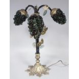 A 20thC table lamp, of naturalistic design, with an entwined stem set with glass sectional berry