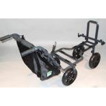 A modern Preston Innovations four wheel trolley, with metal frame and canvas bag with chrome spokes,