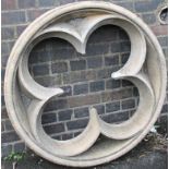 An ecclesiastical style stone roundel, with inverted cloverleaf centre, 100cm dia.