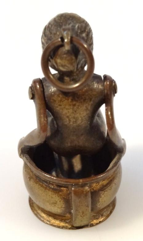 An early 20thC cast metal novelty cigar cutter, formed as a nude lady in seated position on an - Image 2 of 2