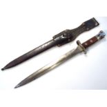 A VP L 97 bayonet and scabbard, with shaped blade, metal and leather scabbard no. 39 stamped AV3,