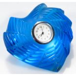 A modern Lalique France clock, in a blue heart shaped surround with a 2cm dia. Arabic dial etched