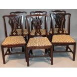 A set of six 19thC mahogany Chippendale design dining chairs, with shaped comb backs and pierced