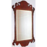 A 19thC walnut framed pier glass, the shaped scroll frame centred by a bevel mirror with an outer