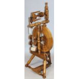 A 20thC elm spinning Miniature Jenny Wee Peggy style spinning wheel, with articulated central