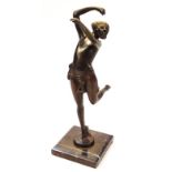A 20thC Art Deco design bronzed marble finish figure, of a lady semi-clad in dancing pose with arm