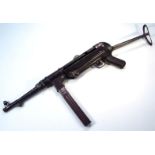 An NP40 MGC68 German machine pistol replica, with removable non magazine, articulated arm end and