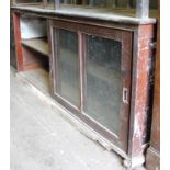 A 19thC pine and mahogany freestanding cabinet, the glazed front with two articulated doors, hinging