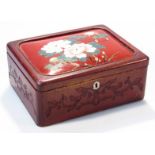 An early 20thC Japanese hardwood and lacquer finish jewellery casket, the rectangular lid with a