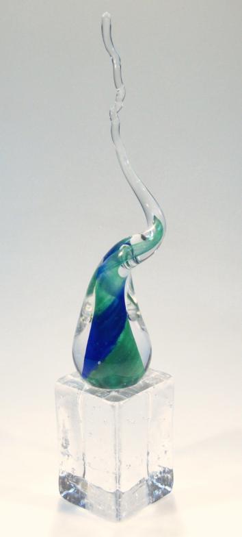 A 20thC Svasa glass sculpture, Defying Convention, with a swirl top in green and blue, on a plinth