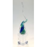 A 20thC Svasa glass sculpture, Defying Convention, with a swirl top in green and blue, on a plinth