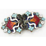 An Edwardian Art Nouveau double enamel buckle, decorated with flowers and scrolls in orange, red,