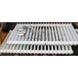 *A pair of metal framed radiators, each with 21 sections, painted white and green, with metal