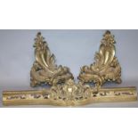 A 19thC French rococo fender with chenet ends,