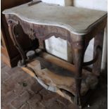 An 18thC marble topped hall table, the frieze centred by a floral roundel flanked by hairy paw