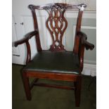 A late 18th/early 19thC country made fruitwood open armchair, with a carved rail, a pierced splat