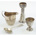 A George VI silver egg cup, Birmingham 1944, semi fluted cream jug, Edward VII silver baby's