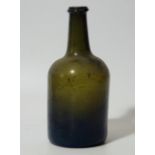 An 18thC green bottle, of shouldered cylindrical form, (uncorked), 25cm high.