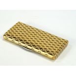 A French Art Deco yellow metal combined cigarette and vesta case, with geometric design in white and