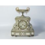 A 19thC French alabaster mantel clock, with eight day movement striking a bell.