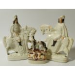 A pair of 19thC Staffordshire equestrian group figures, each sparsely decorated with gilt