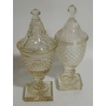 Two early Victorian cut crystal bon bon urns, with covers, 34cm high.