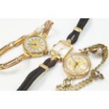 Three mid 20thC ladies' gold cased watches.