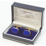 A pair of 9ct gold cufflinks, set with royal blue gold stone, 9.4g all in.
