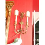 A pair of wall lights, with acanthus boss and pineapple finial.