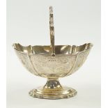 A Victorian silver basket, of fluted oval pedestal form with engraved foliate decoration, Walker &