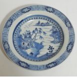 An 18thC Chinese export blue and white porcelain bowl, decorated with a figure and fence before