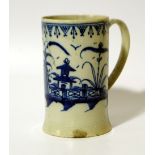 An 18thC Liverpool blue and white porcelain cider tankard, the cylindrical body with strapwork