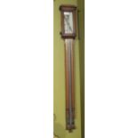 A 20thC oak cased stick barometer.