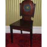 A George IV mahogany hall chair, the shaped back painted to the centre with the letter 'R', with a