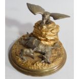 A 19thC French silvered and gilt bronze inkstand, in the form of an eagle on a rocky mound