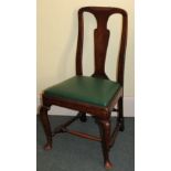 An 18thC fruitwood side chair, with a solid splat, a green leather padded seat on cabriole legs with